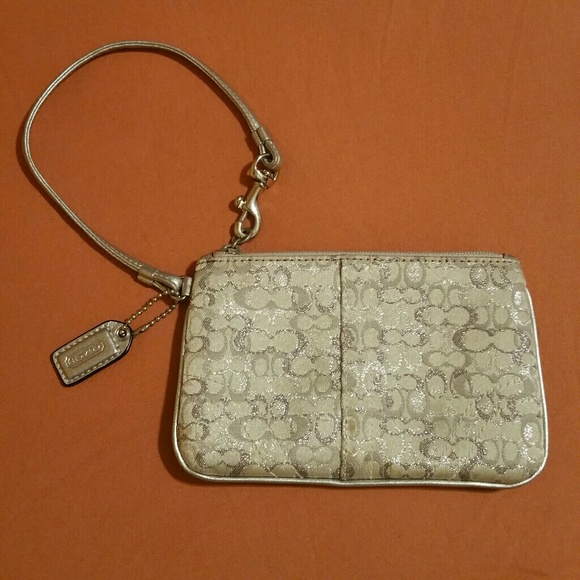 Coach Handbags - Coach silver pouch wristlet 4x6